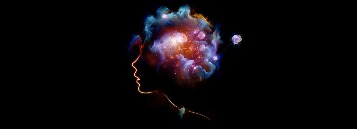 Black background with a digital image of a human head with a galaxy where the brain should be