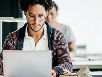 Male student engaging in online learning