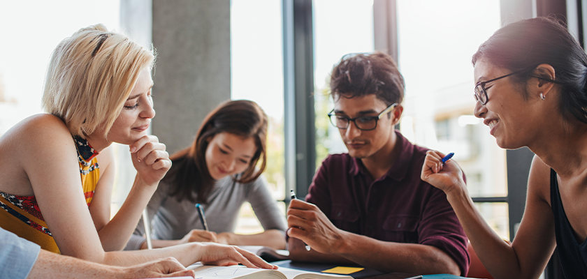 Group of diverse students studying together