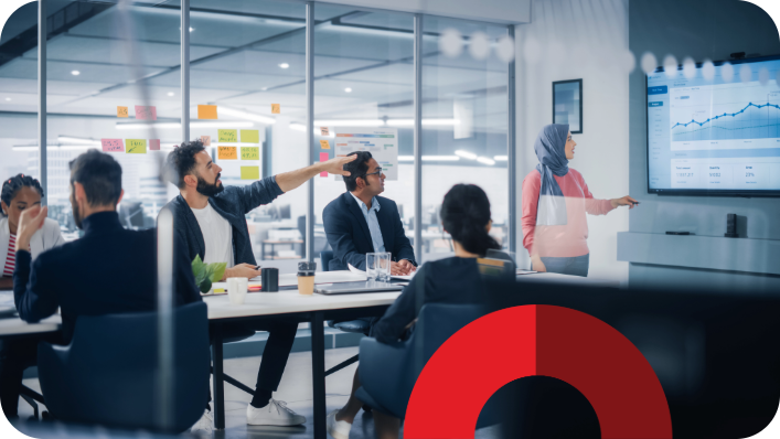 Students working in a seminar room watching a presentation, with a decorative red half circle brand element overlay.